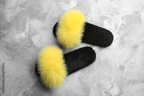 Pair of soft slippers on grey background, flat lay