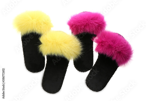 Soft open toe slippers with yellow and pink fur on white background, top view