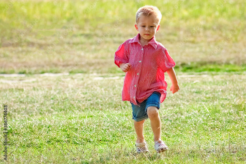 Happy child playing in nature in summer Happy child playing in nature in summer