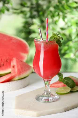 Delicious fresh watermelon drink on white wooden table