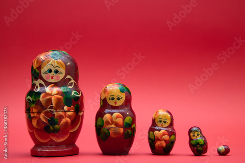 A set of wooden matryoshka dolls on warm background photo