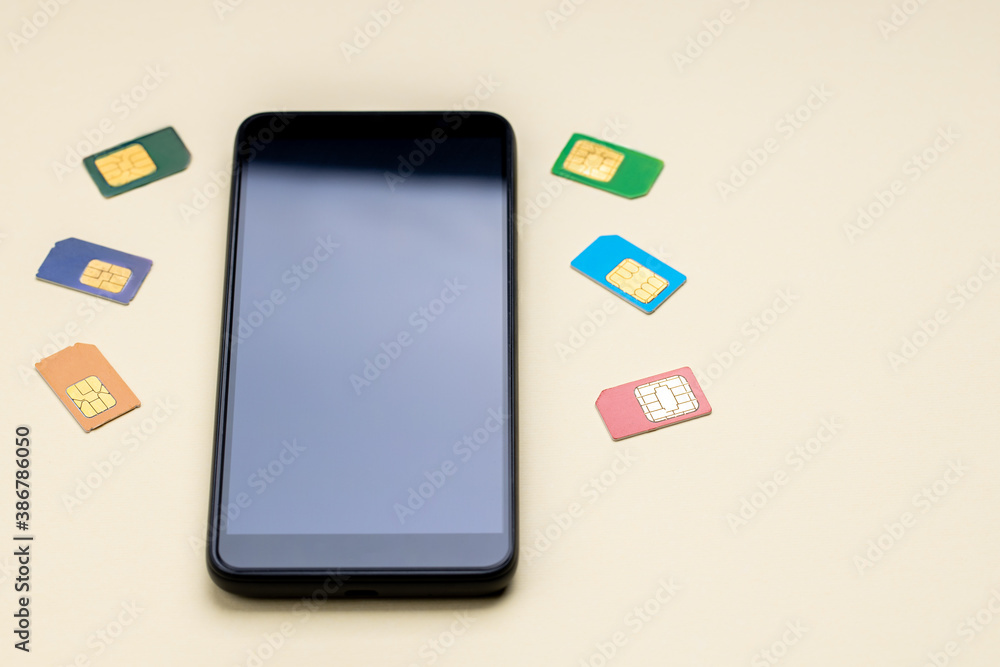 mobile phone or smartphone and variation of sim cards. different kinds of a mobile microchips. choose mobile service providers concept