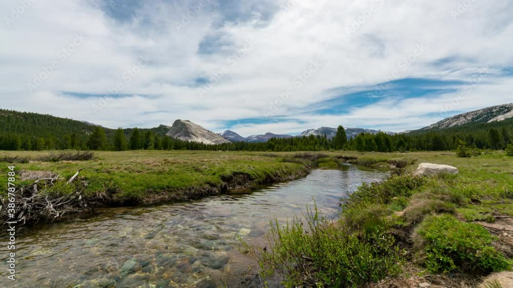 Time lapse of stream running through Tuolumne Meadows in Yosemite National Park, California Time lapse of stream running through Tuolumne Meadows in Yosemite National Park, California