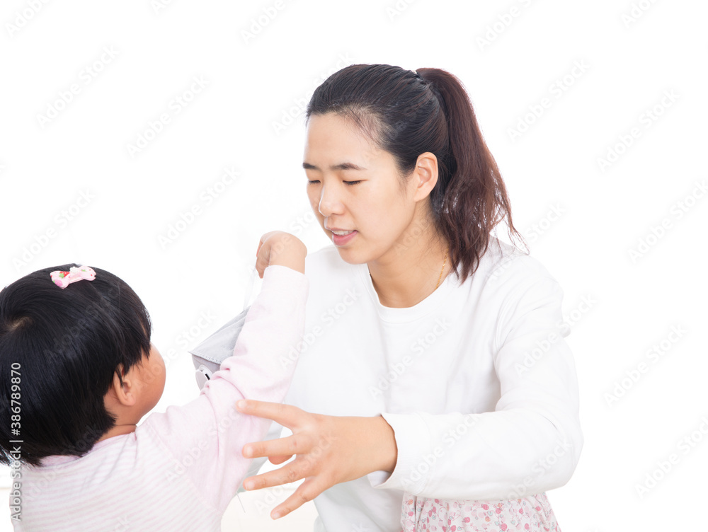 Daughter and mother are analyzing how to wear masks Daughter and mother are analyzing how to wear masks