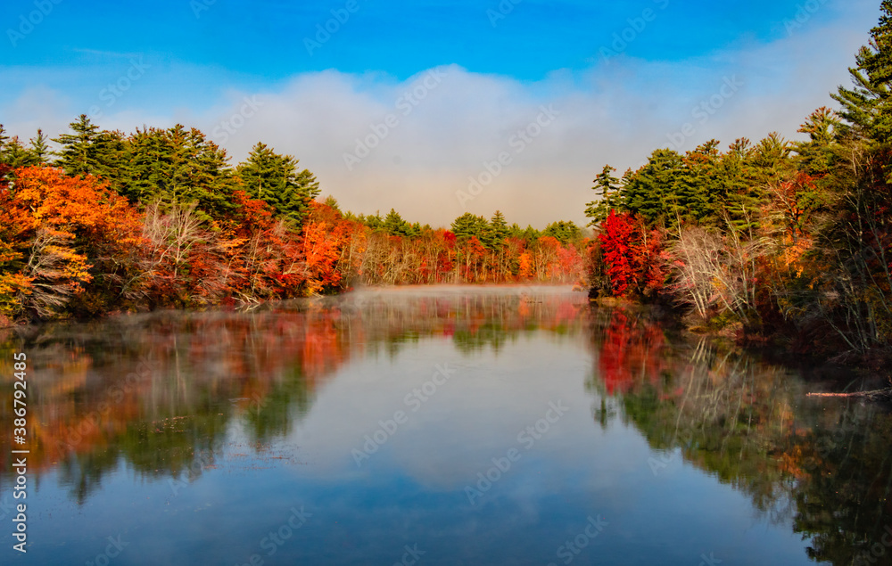 Awesome reflection of autumn lake on a misty morning Awesome reflection of autumn lake on a misty morning
