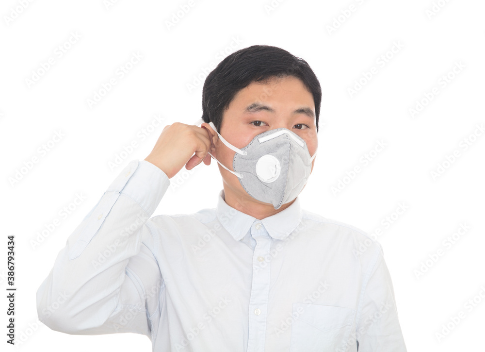Young man preparing to take off his mask Young man preparing to take off his mask