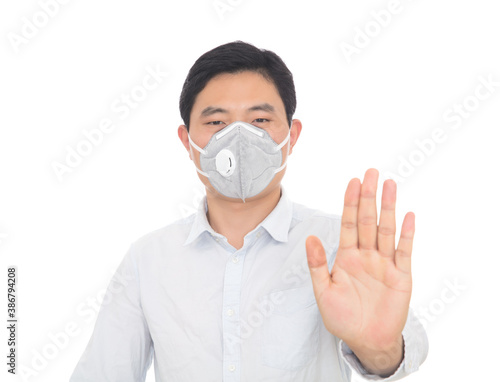 Man wearing mask makes rejection gesture