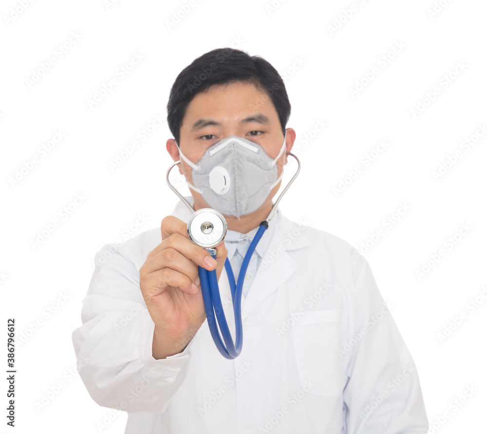 Male doctor holding stethoscope in hand wearing mask