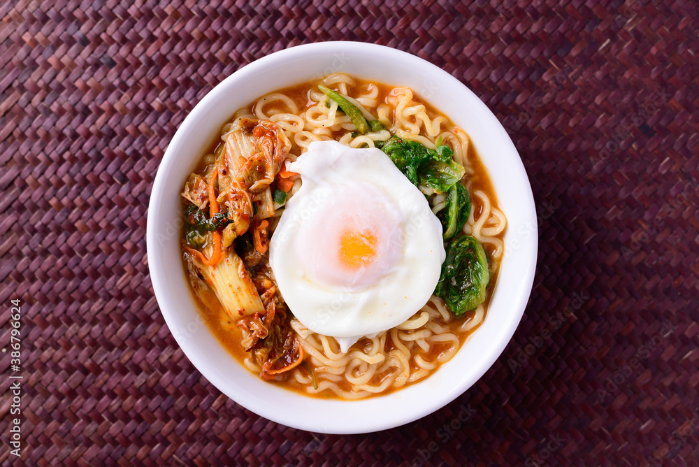 Korean food, Spicy noodles soup with kimchi and egg, Top view Korean food, Spicy noodles soup with kimchi and egg, Top view