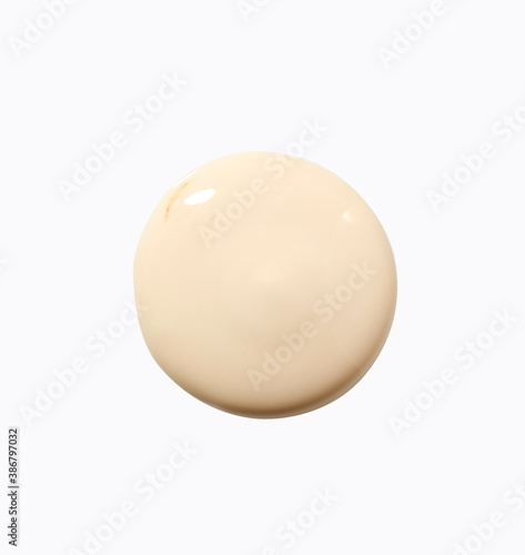 Cosmetic cream in round shape on background