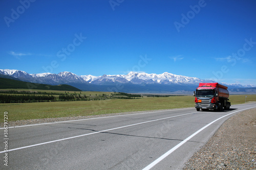 truck on the famous highway in Altai - Chuisky tract. The road, which is accompanied by the mountains. © Anna_Barynina