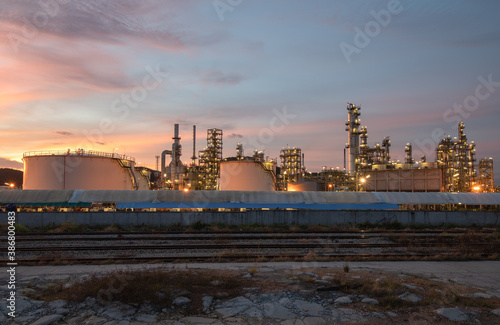Industrial zone view, oil and gas refinery in sunset and dusk sky.