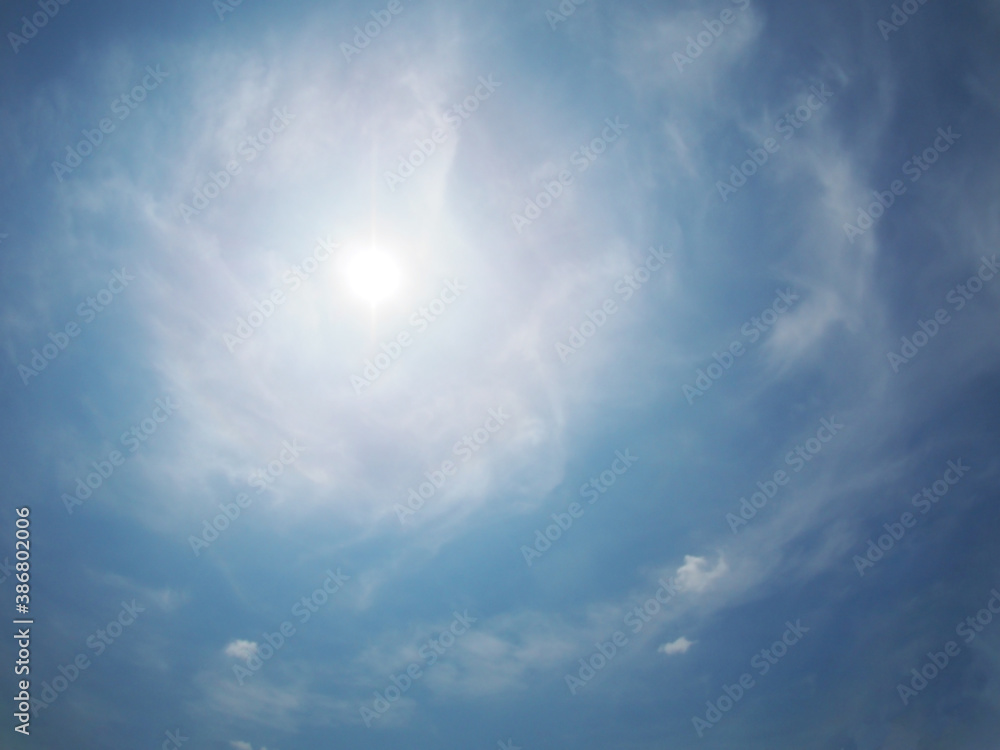 Shiny Sun on blue sky at noon