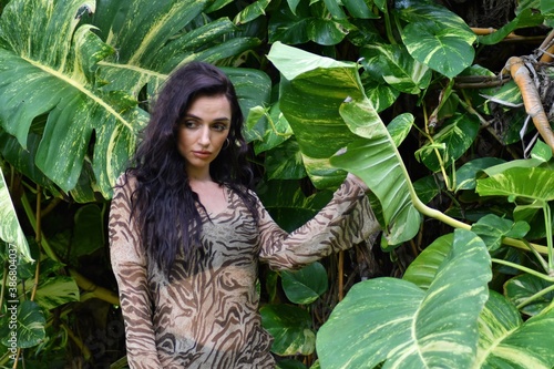 beautiful woman enjoying nature in green forest