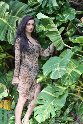 Portrait of a beautiful young woman posing in nature