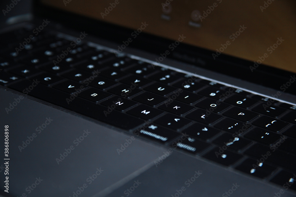 Close-up of laptop keyboard with selective focus on button Close-up of laptop keyboard with selective focus on button