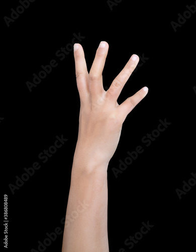 A hand grabbing upwards in front of a black background