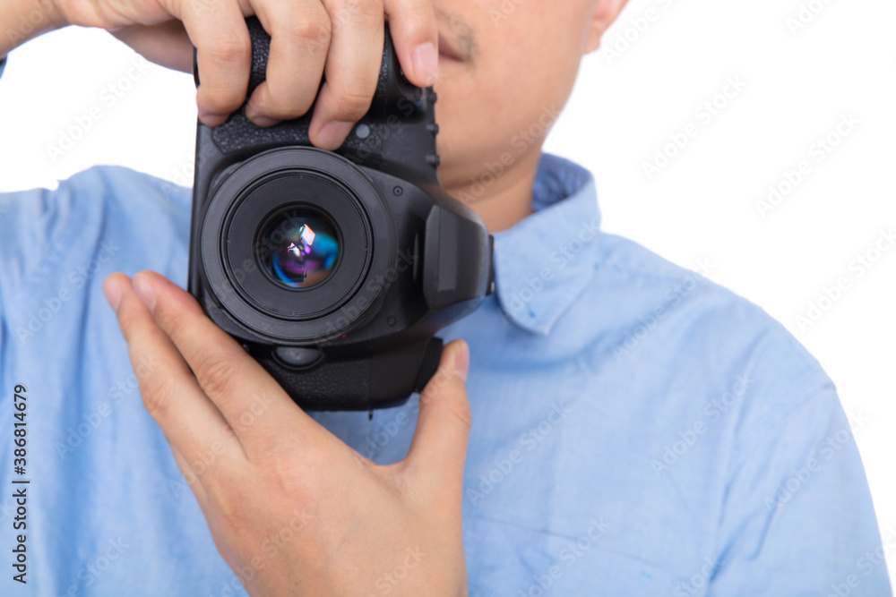 Male photographer shooting with SLR camera