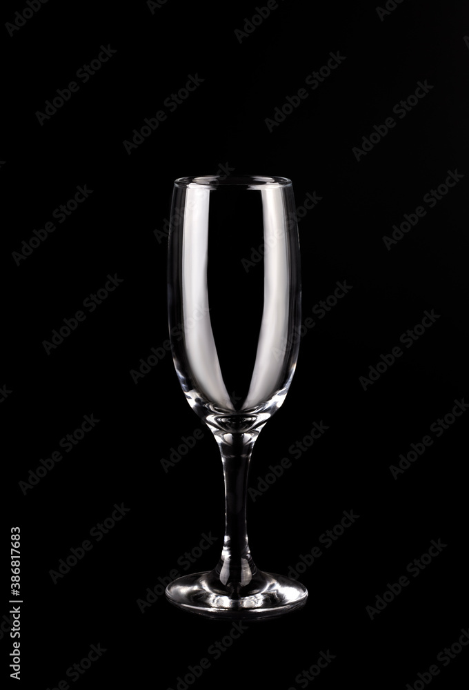 empty champagne glass on a black background.