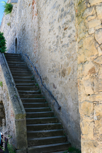 Stone castle staircase outside by the wall. © lapis2380
