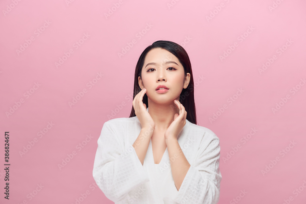Beautiful Asian young woman touching neck smile with clean and fresh skin Beautiful Asian young woman touching neck smile with clean and fresh skin