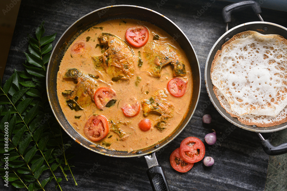 Top view spicy Kerala Style Fish stew and Appam Fish Molee or Meen ...