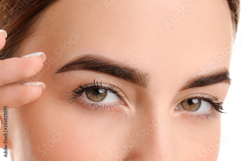 Canvas Print Young woman with beautiful eyebrows, closeup
