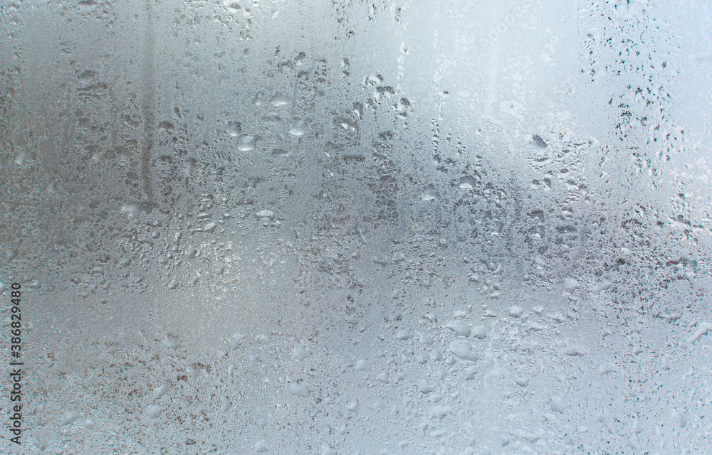 A pattern of frozen drops on the window A pattern of frozen drops on the window
