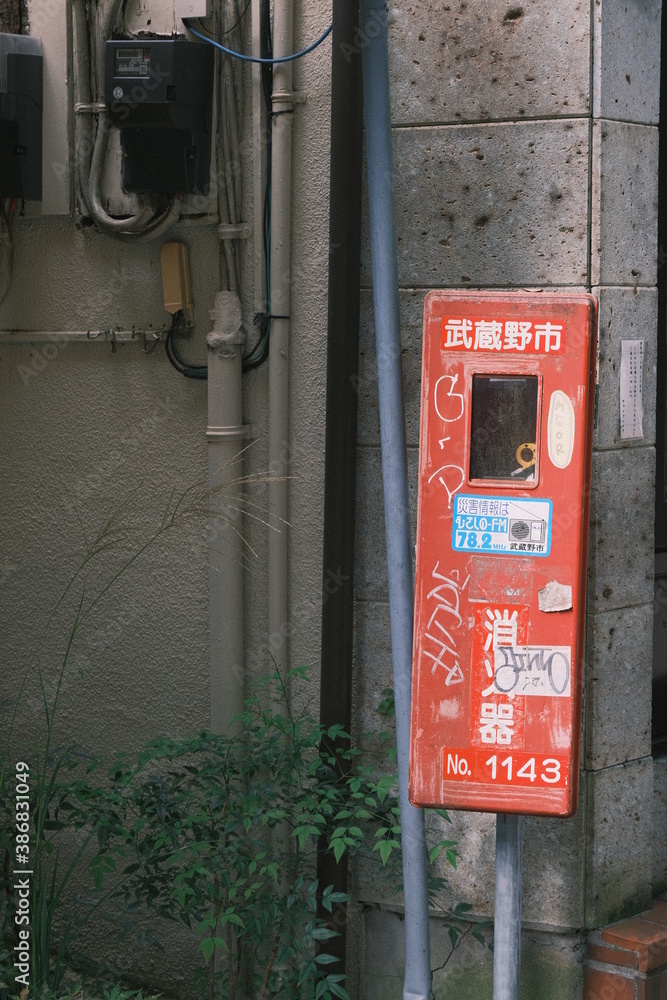 Fototapeta premium fire hydrant covered in graffiti against the wall
