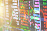 Closeup Display of Stock market quotes with city scene reflect on glass of LED, stock market graph on the screen, Business, finance or investment background concept