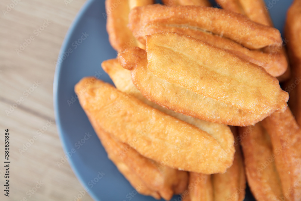Looking down and shooting a plate of fried dough sticks Looking down and shooting a plate of fried dough sticks