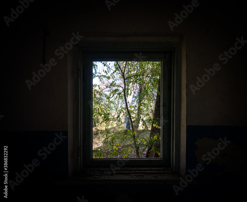 view from the window of an abandoned abandoned house in the village of Ukraine