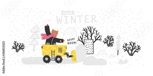 Funny bear rides through the forest on a bulldozer. Winter forest landscape. Snow removal. Winter postcard.