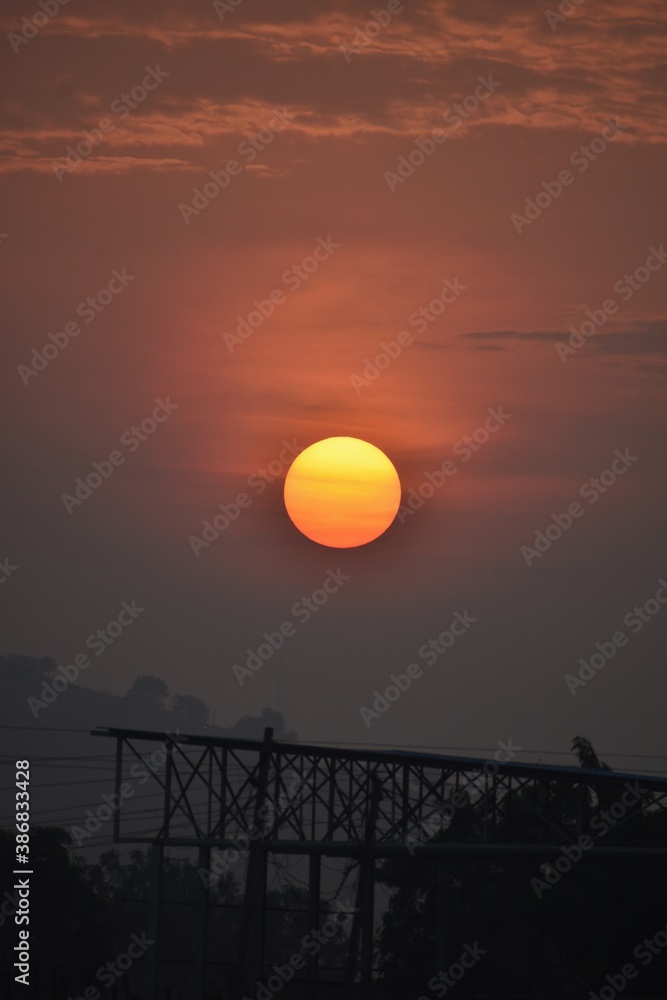 Obraz premium sunset over industrial area