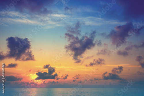 Colorful cloudy sky over the sea at sunrise. Seascape in the early morning. Sunrise over the sea. Sea view with beautiful colorful cloudy sky