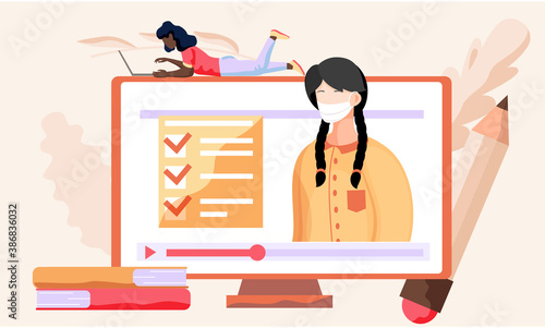 A girl with a laptop lies on monitor and works or studies on her computer from home during COVID-19. Online learning with a video about the need to prevent the spread of coronavirus. Quarantine