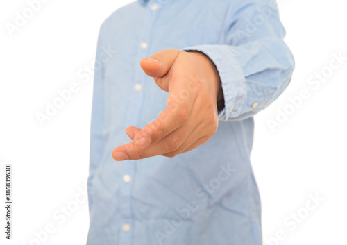 Man in shirt reaches out for handshake gesture