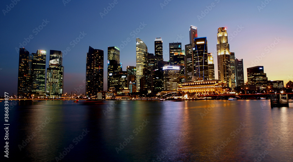 
night view of urban buildings seen from the sea side