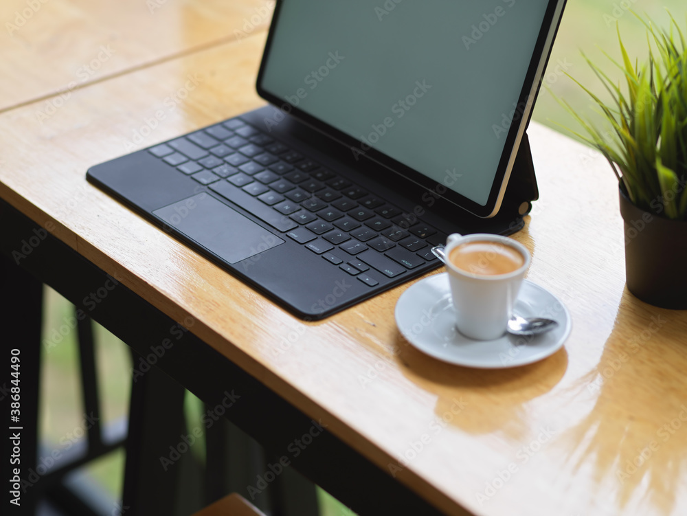 Portable workspace with mock up digital tablet, coffee cup and plant pot Portable workspace with mock up digital tablet, coffee cup and plant pot