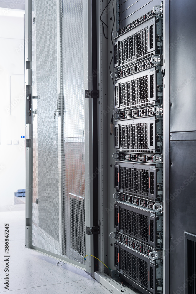 Racks filled with data storage hardware inside internet datacenter Racks filled with data storage hardware inside internet datacenter