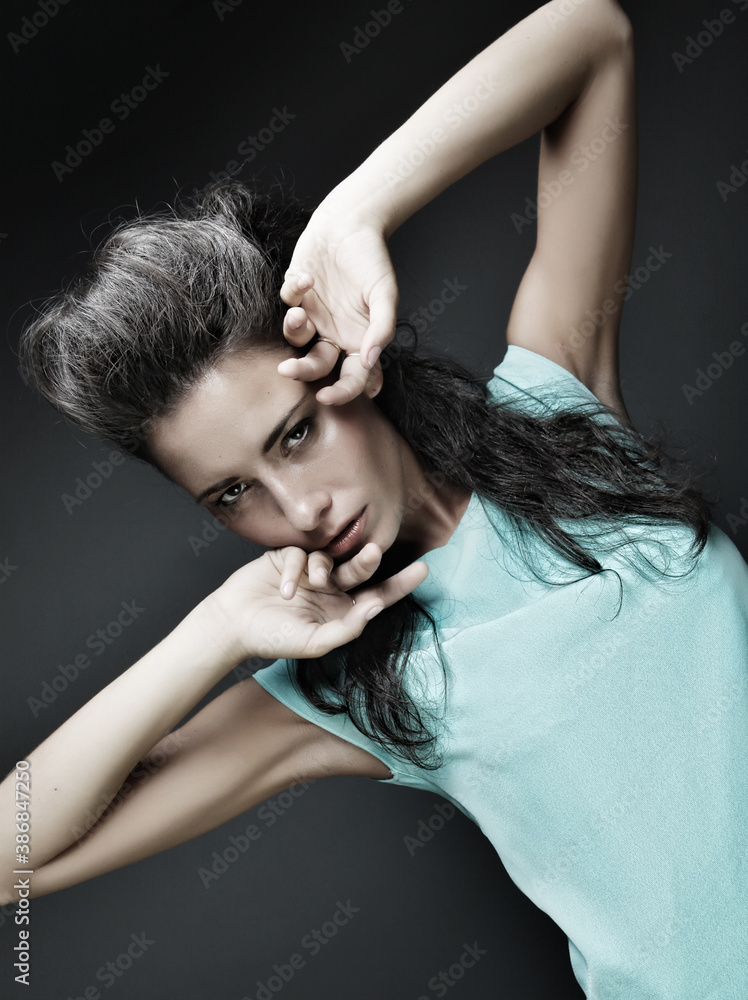 Fototapeta premium beautiful brunette girl in a blue dress