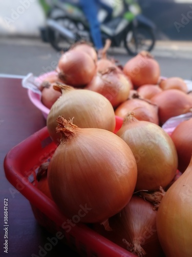 onions in a basket of the market