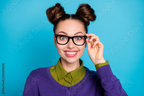 Close-up portrait of her she nice attractive lovely funny cheerful cheery brown-haired girl touching specs isolated on bright vivid shine vibrant blue green teal turquoise color background