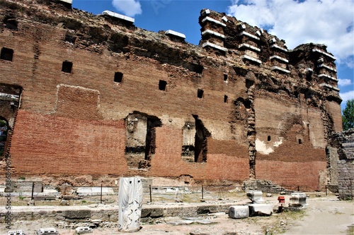 Ancient Bazilika Redhall. Bergama, Turkey. Redhall Bazilika ancient walls made of red bricks. during sunny day and blue and white sky. photo