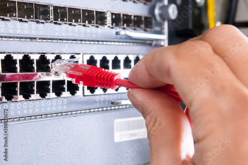 Obraz na płótnie hand with red ethernet cable