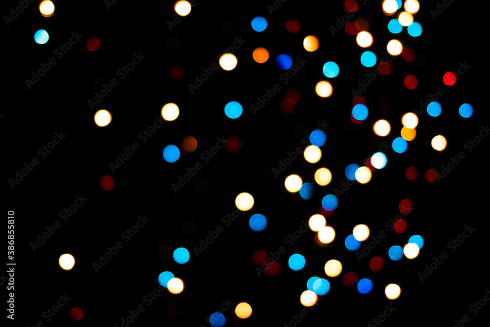 A brilliant glowing background side on black. The glitter light bokeh for the New Year and other holidays. Place for text copyspace. A brilliant glowing background side on black. The glitter light bokeh for the New Year and other holidays. Place for text copyspace.