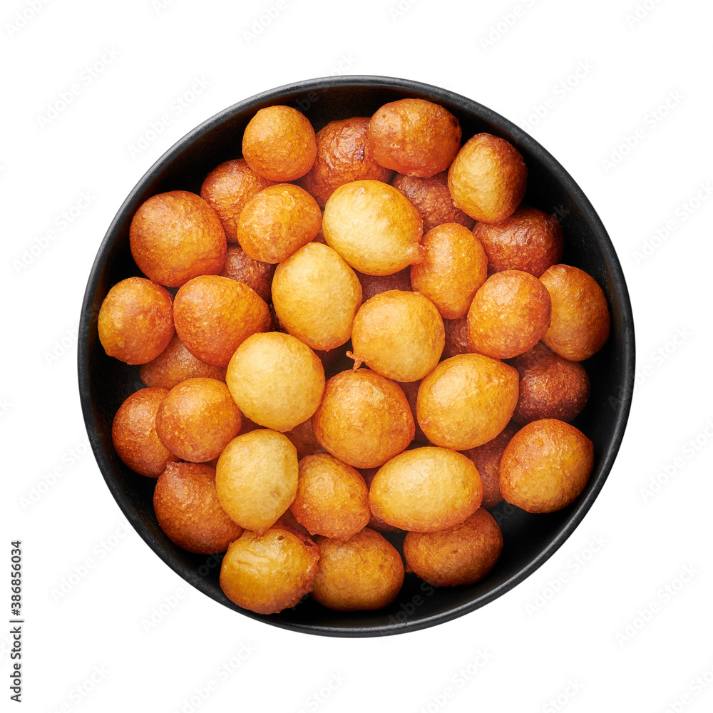 Loukoumades or luqaimat or lokma in black bowl isolated on white background. Loukoumades is eastern cuisine donunts popular during Ramazan. Popular Ramadan Food. Iftar and Suhur sweets Loukoumades or luqaimat or lokma in black bowl isolated on white background. Loukoumades is eastern cuisine donunts popular during Ramazan. Popular Ramadan Food. Iftar and Suhur sweets