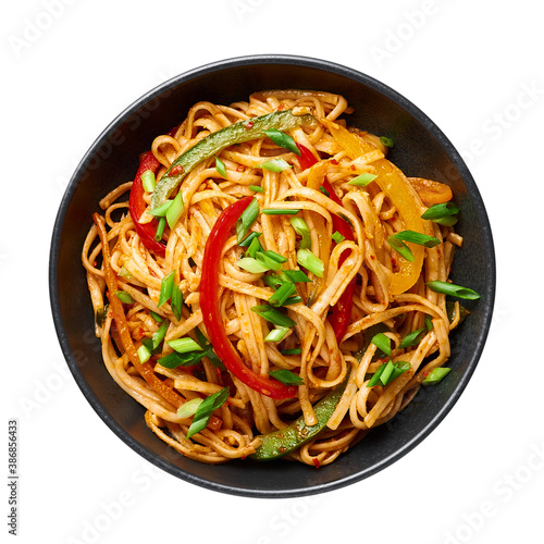 Vegetarian Schezwan Noodles or Vegetable Hakka Noodles or Chow Mein isolated on white background. Schezwan Noodles is indo-chinese cuisine hot dish with udon noodles, vegetables and chilli sauce photo