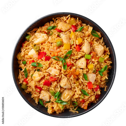 Schezwan Chicken Fried Rice in black bowl isolated on white background. Szechuan Rice is indo-chinese cuisine dish with bell peppers, green beans, carrot, chicken breasts. Top view