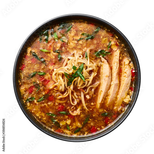 Chicken Manchow Soup isolated on white background. Chicken Manchow Soup is indo-chinese cuisine dish with bell peppers, cabbage, carrot, noodles, chilli, soy sauce, onion, chicken breasts.